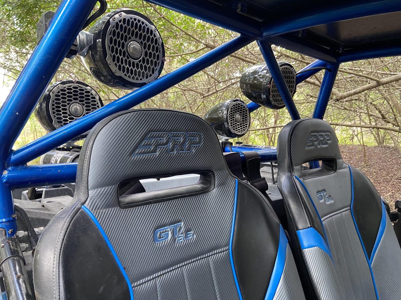 Blue off-road buggy with tower speakers and PRP seats