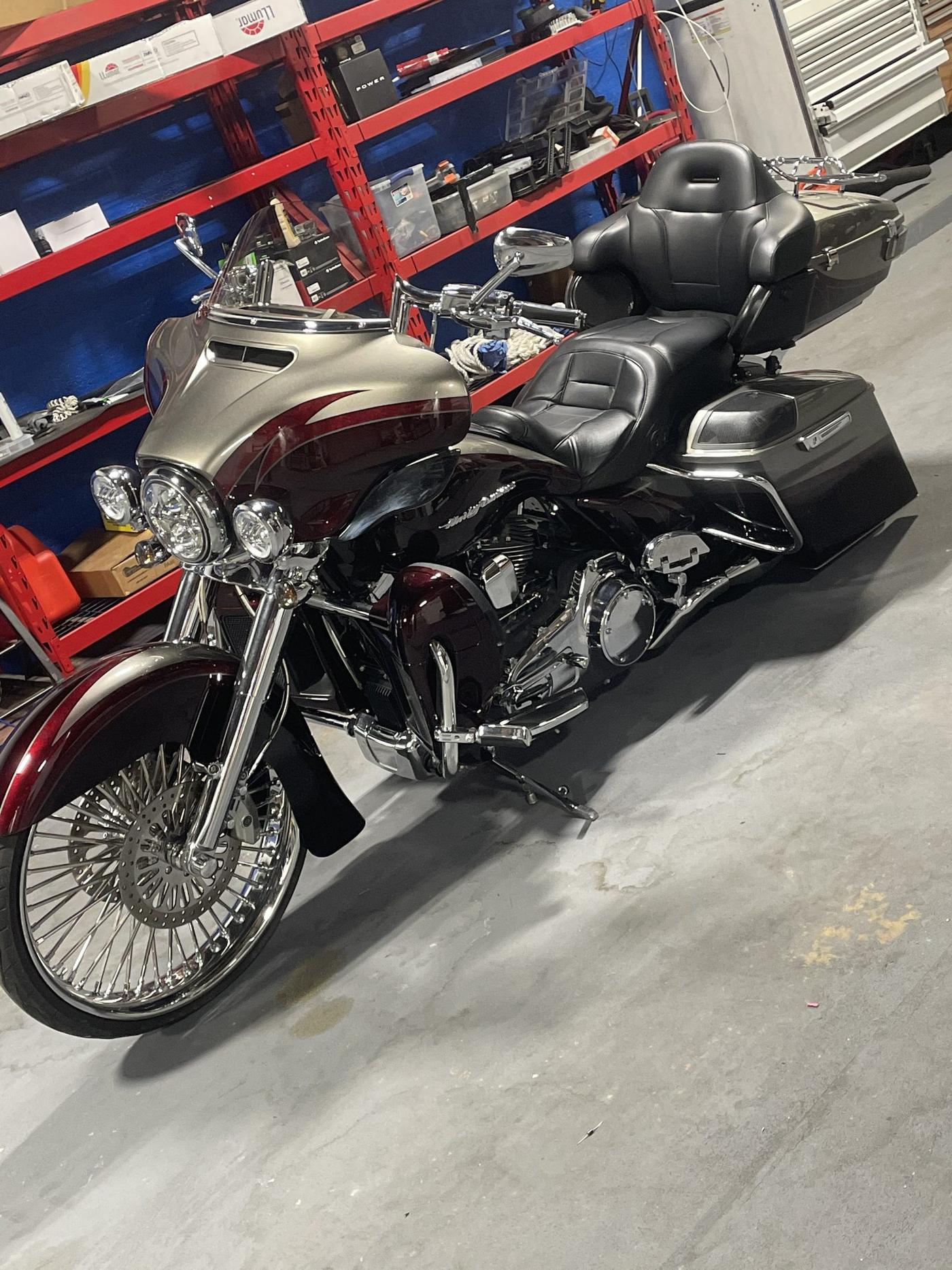 Dark red Harley-Davidson Road Glide on the shop floor
