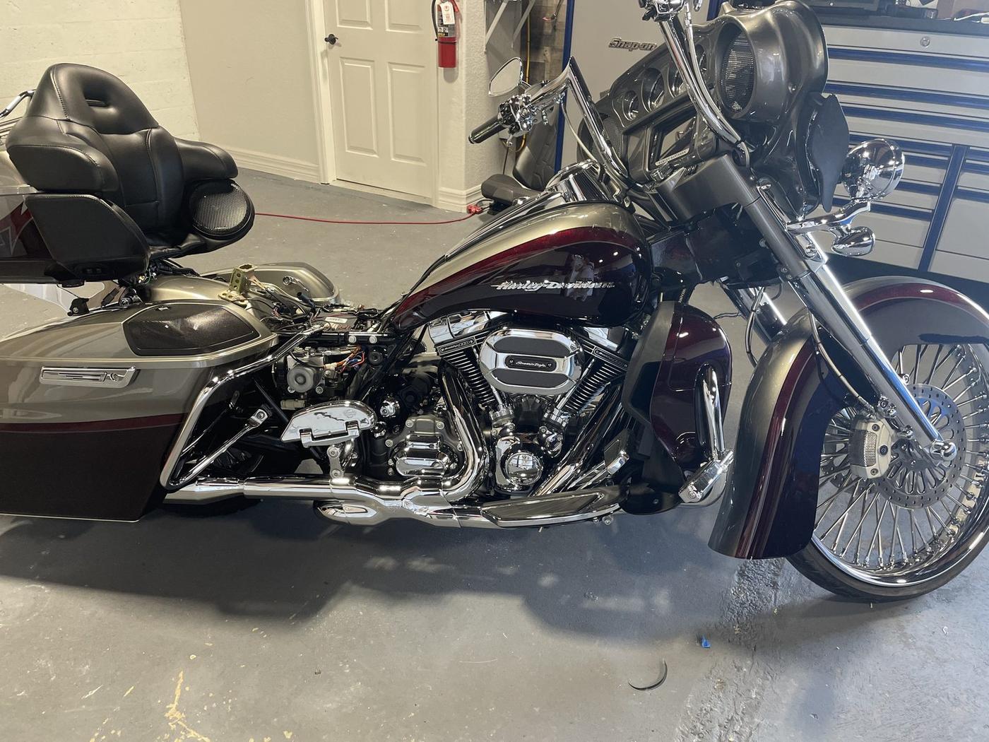 Dark red Harley-Davidson Road Glide bagger, side view