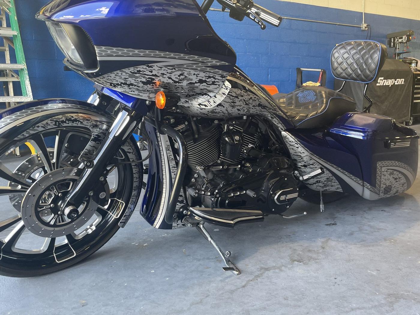Custom bagger Harley-Davidson with big front wheel and full audio build